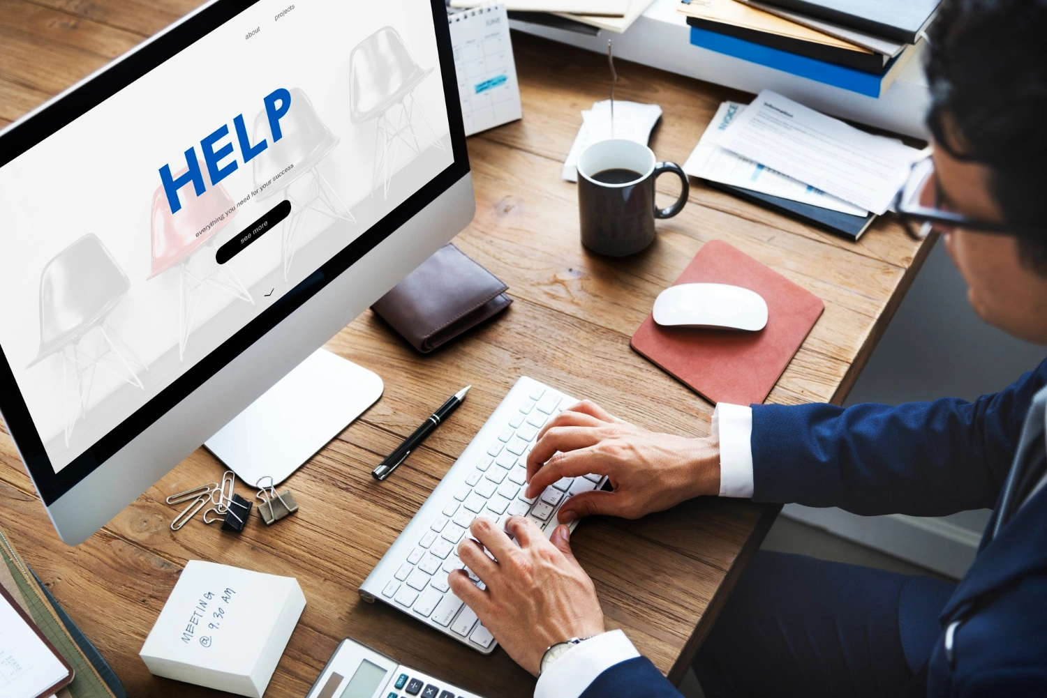 Close-up of a delicate white flower with visible veins on petals and stamens, against a dark blurred background.